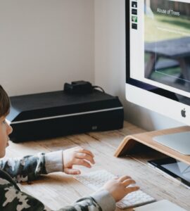 boy looking at computer