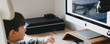 boy looking at computer