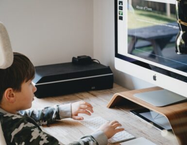 boy looking at computer